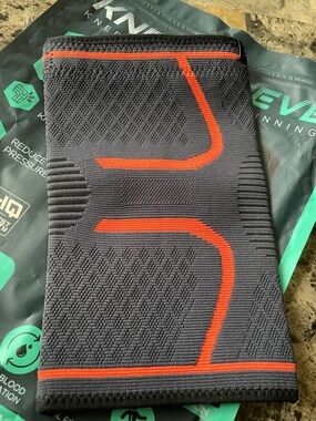 Compression Sleeve for knee- Charcoal with Orange Accents (one brace Sz med)
